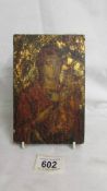 An antique hand painted icon on wood.