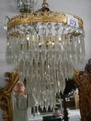 A four tier glass chandelier. Collect only.