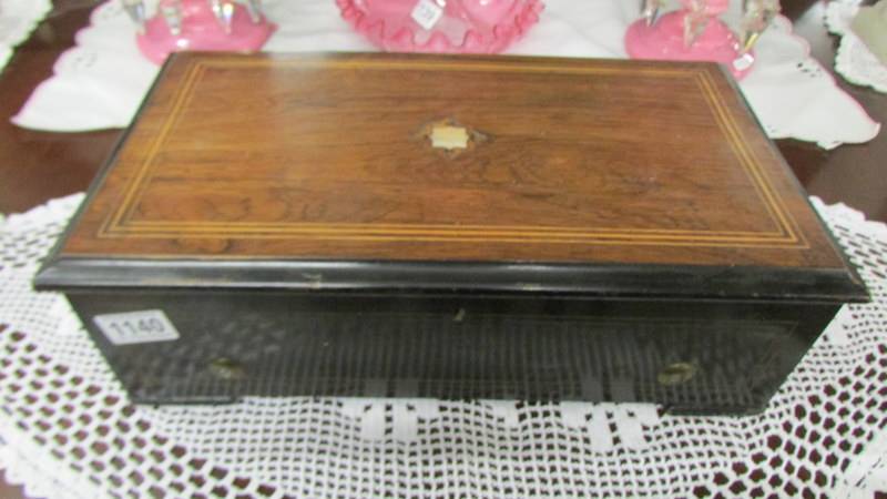 A good Victorian six tune music box in good working order. No missing teeth or pins.