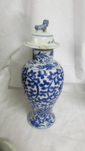 A pair of early Chinese blue and white lidded vases (both lids a/f) and a blue and white flask. - Image 2 of 25