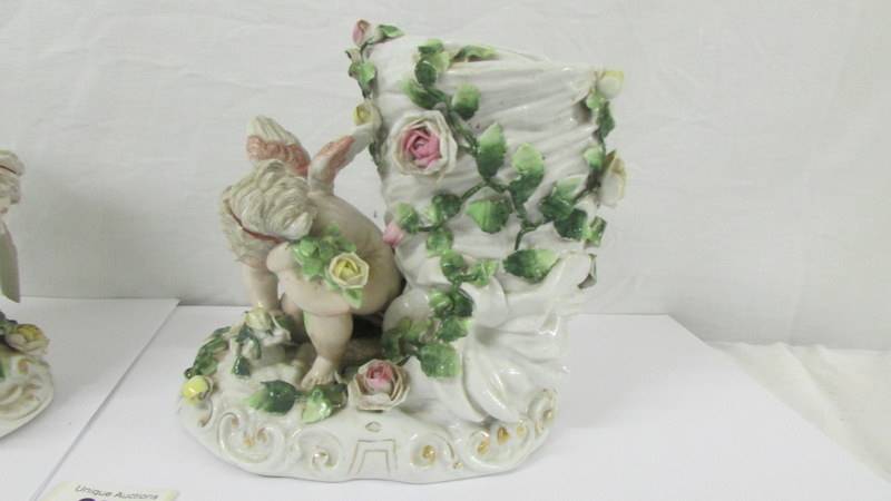 A pair of 19th century continental porcelain cherub vases (possibly Szitzendorf). - Image 3 of 10