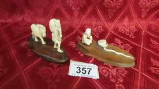 An antique ivory snake charmer figure on wood stand and an antique ivory farmer on wood stand.