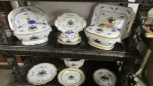 A part dinner set with armorial decoration, marked Villa Garnelo