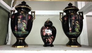 A pair of 19th century Olympic lidded urns with oriental decoration. (height 39cm) & Carltonware urn