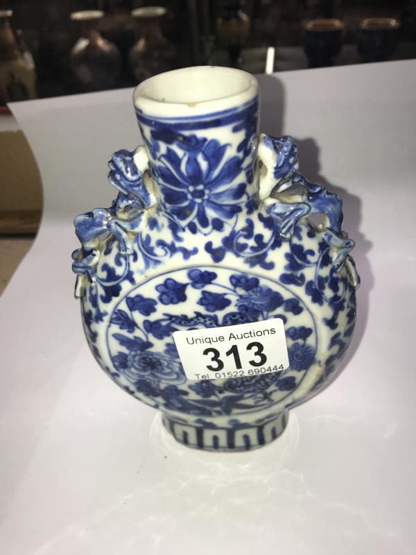 A pair of early Chinese blue and white lidded vases (both lids a/f) and a blue and white flask. - Image 12 of 25