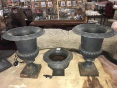 A pair plus 1 cast iron garden urns Height 43cm, Height 20cm