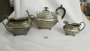 A three piece hall marked silver tea set, total weight 825 grams.