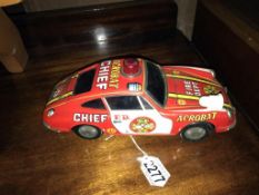 A Japanese tin plate battery operated acrobat fire chief Porsche 911 car (working)