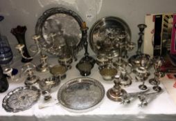 A good selection of silver plate including candelabra, trays & candlesticks etc.