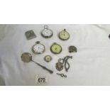 A mixed lot of pocket watches, lighter, watch fob etc.,