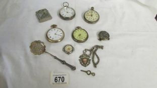 A mixed lot of pocket watches, lighter, watch fob etc.,