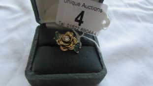 A 9ct gold floral ring set central diamond, size N.