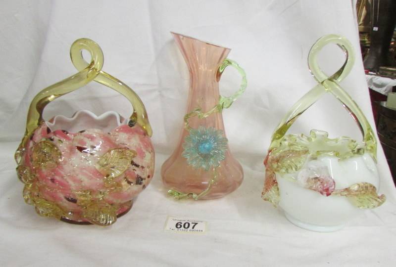 Two 19th-century glass baskets and a jug, all with applied flowers (baskets have chips to flowers,