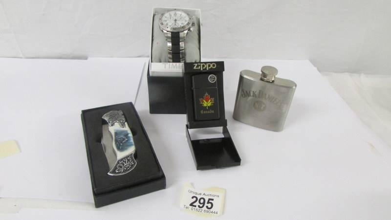 A gent's quartz Timex wrist watch boxed and un-used (working), a Canadian Zippo lighter boxed and