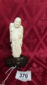 An antique carved ivory Chinese figure. In good condition. Figure height 118mm. Total weight