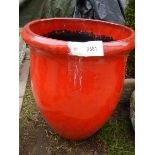 A large glazed terracotta red plant pot. 28 x 59 cm. Collect only.