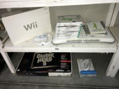 A Nintendo Wii, accessories & games (1 still sealed)