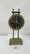 A Victorian brass gravity clock, in working order.