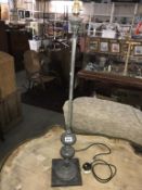 A cast white metal tall table lamp Height 93.5cm
