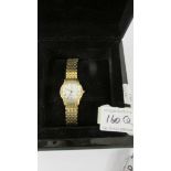 A boxed gold plated Christopher Ward Swiss made women's wrist watch with diamonds.