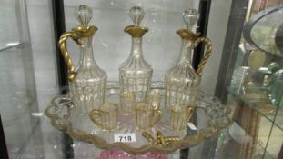 A three bottle decanter set on tray, a/f. Collect only.