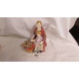 A Royal Doulton figurine, Blossom, HN 1667. Some rubbing to glaze at bottom of rear cloak. No