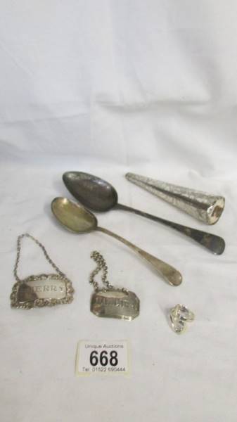 Two silver spoons, two silver spirit lables, A Victorian cone shaped perfume bottle a/f, etc.,