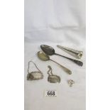 Two silver spoons, two silver spirit lables, A Victorian cone shaped perfume bottle a/f, etc.,