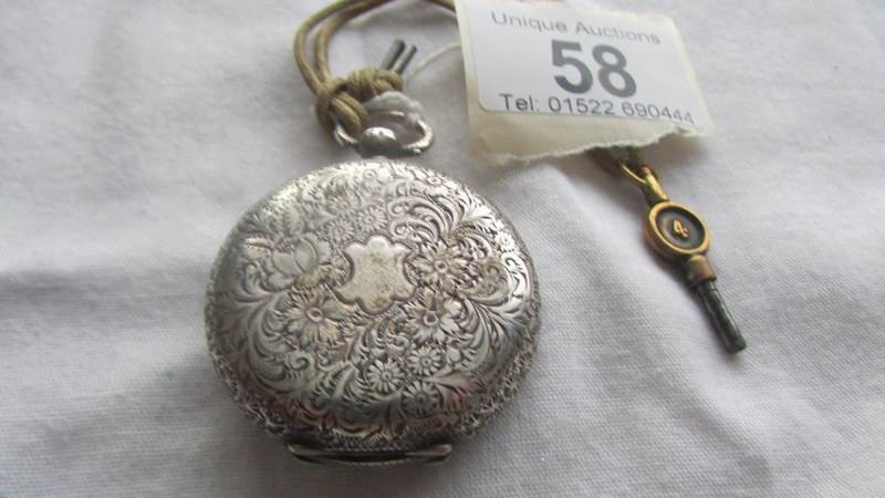 A Victorian ladies silver fob watch in working order. - Image 2 of 2