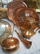 Three polished copper trays, a copper chestnut roaster, copper coffee pot and copper horn, Collect