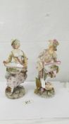 A pair of 19th century porcelain figurines, 11" tall, no damage or visible signs of repair.