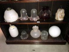 A selection of vintage glass lampshades