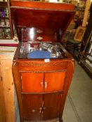 A vintage cabinet gramaphone with 78 rpm records. Collect only.