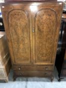 An Edwardian Gent's wardrobe over 2 drawers with walnut veneered doors (84cm x 50cm x 151cm high)