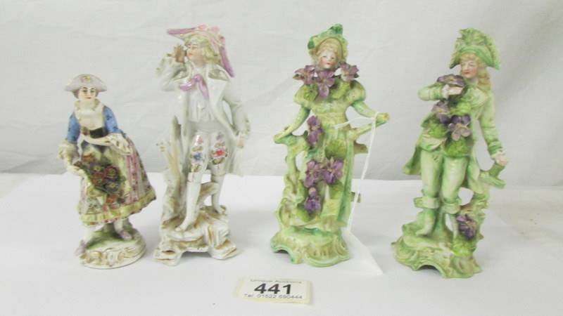 A pair of small continental porcelain figures and two others.