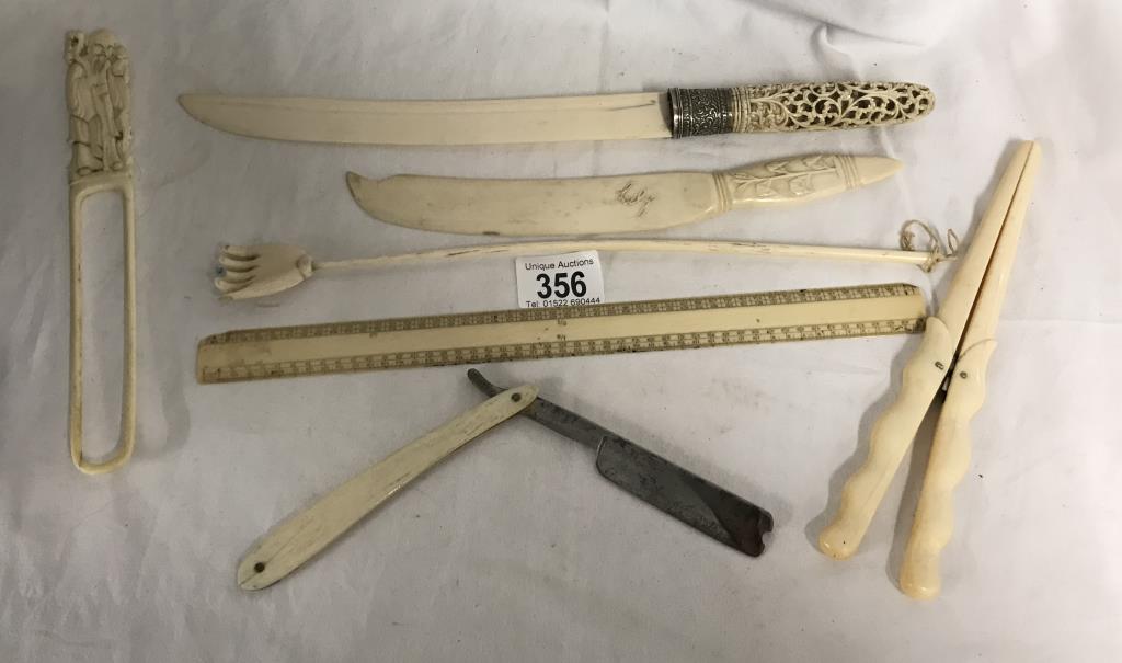 An antique ivory page turner (a/f) glove stretchers, ruler, cut throat razor, paperknife and book - Image 12 of 31