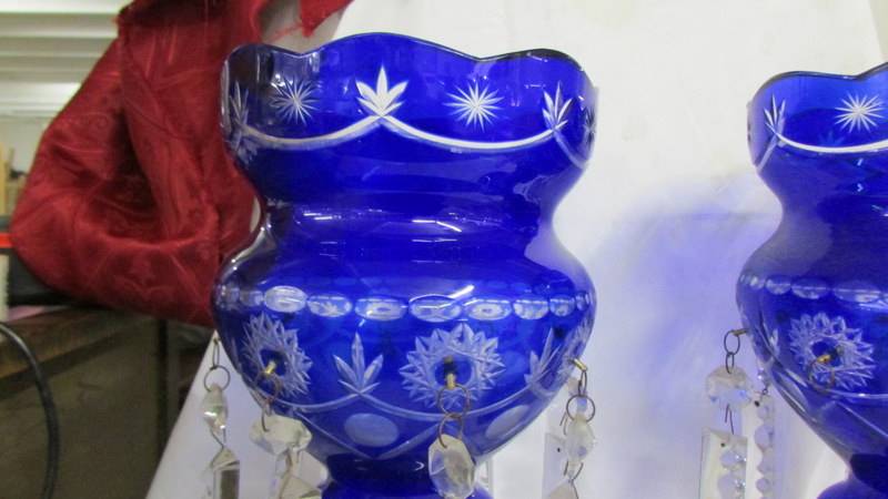 A pair of blue glass overlaid lustre's, (two droppers a/f and one dropper missing). 36 cm tall. - Image 4 of 4