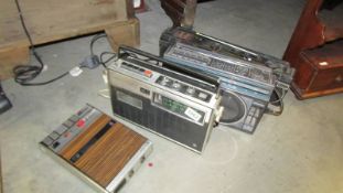 Three vintage radio's and a cassette player.