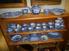 Two shelves of Spode, Enoch Wood etc., blue and white china.