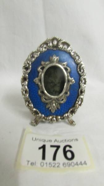 A late 19th/early 20th century white metal and blue guilloche enamel photograph frame, signed KF