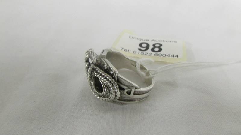 A sterling silver saddle ring set zirconia stones, size V. - Image 2 of 4