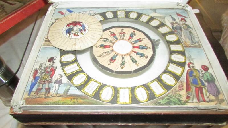 A Victorian 'The Learned Swallow' geographical game, a Jiggle Joggle frog game, an early - Image 3 of 9