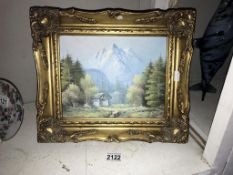 A gilt framed oil on board, mountain scene