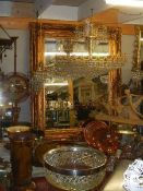 A large ornate double swept bevel edged mirror in gilt frame. 158 x 132 cm. Collect only.