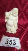 An antique carved ivory Buddha, circa 19th century. Available for UK shipping only.