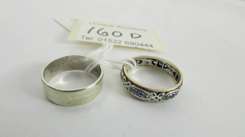 A 9ct gold wedding ring and an unmarked eternity ring, size N.