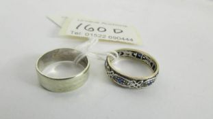 A 9ct gold wedding ring and an unmarked eternity ring, size N.