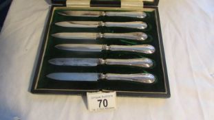 A cased set of six Mappin and Webb butter knives.