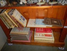 Two shelves of clock and furniture related books etc.,
