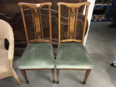 A pair of Edwardian inlaid mahogany hall chairs
